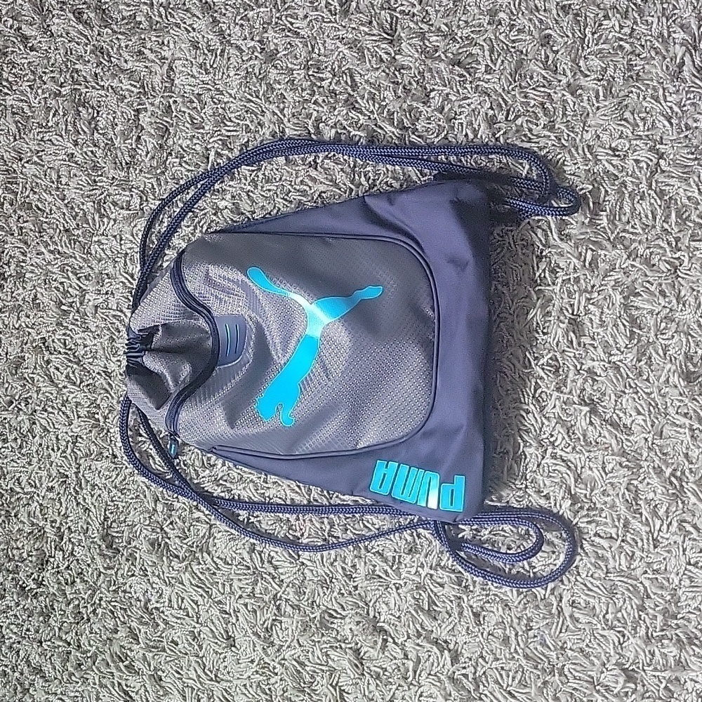 PUMA gray and blue drawstring back pack. Puma logo on front.